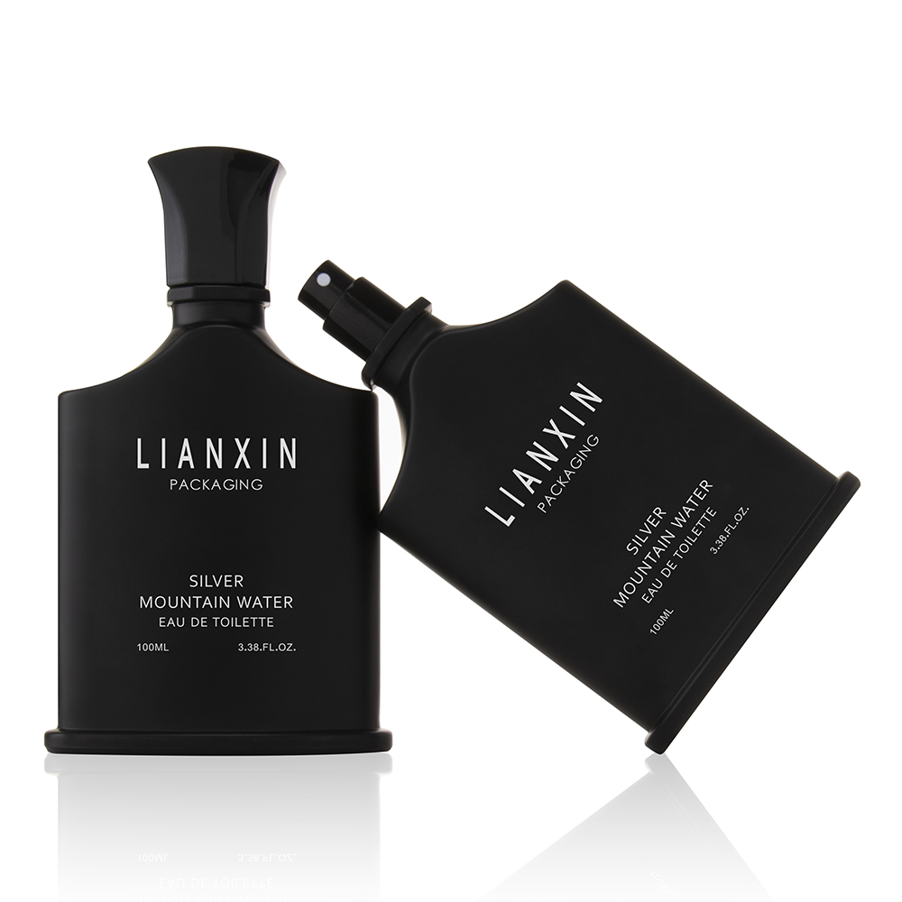 black cologne bottle shaped like a body