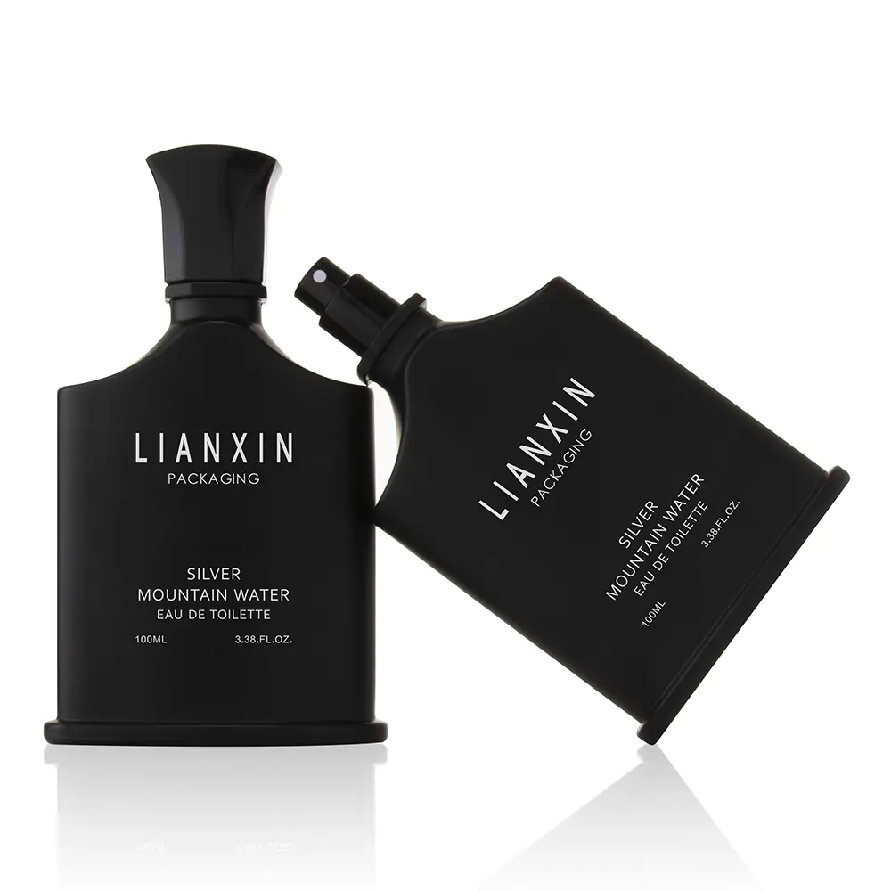 black cologne bottle shaped like a body