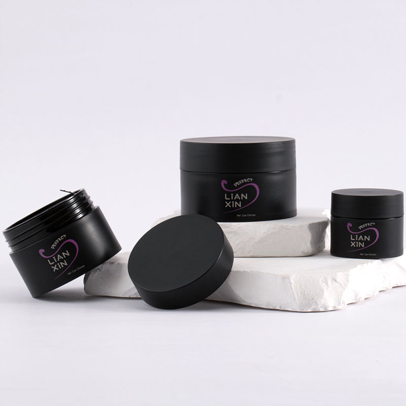 black cosmetic jars
