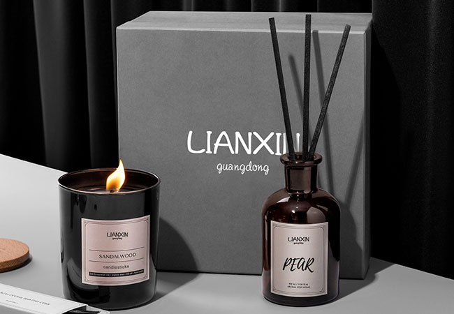 Amber reed diffuser bottle and candle packed in a retail gift box for export shipping
