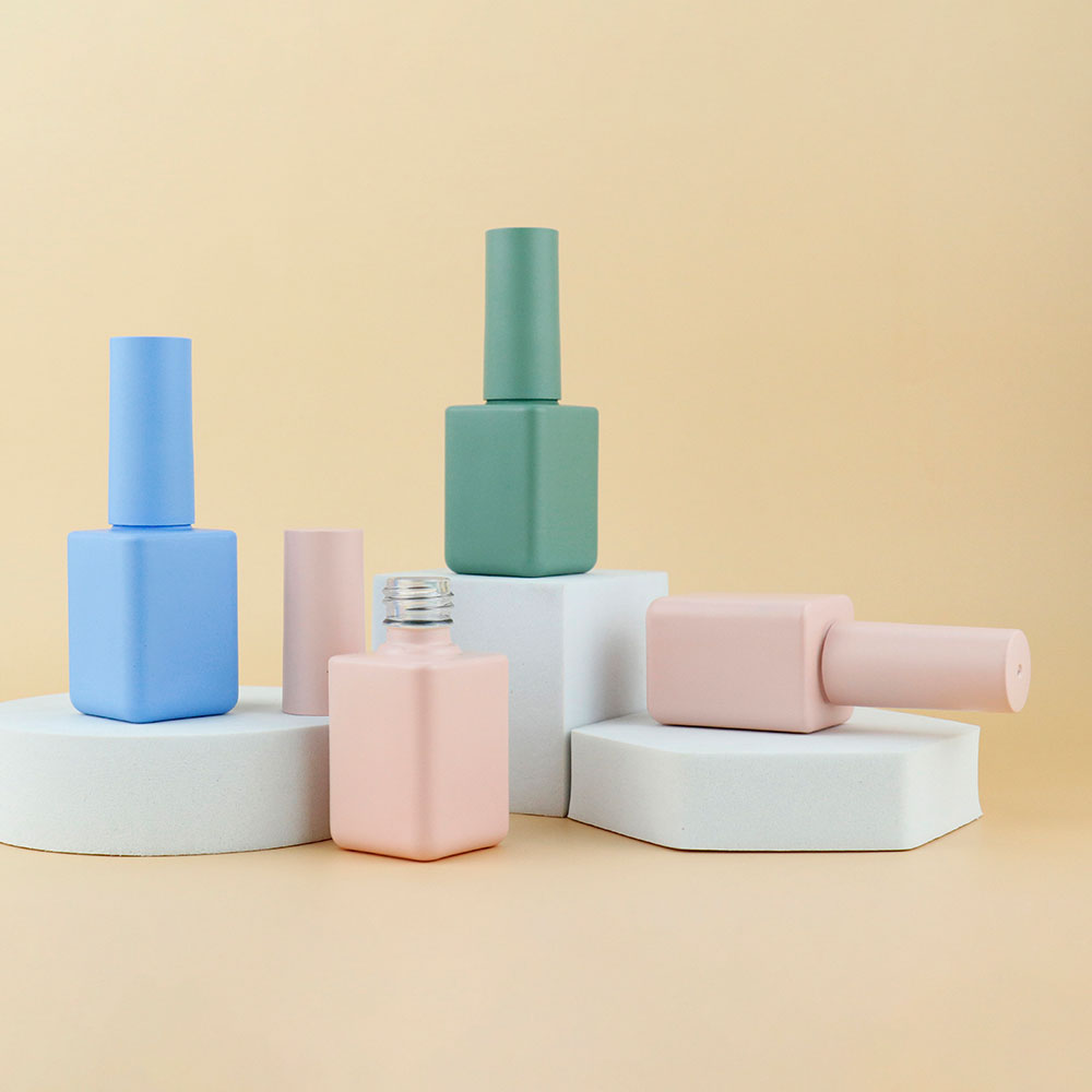 pink empty nail polish bottles with brush