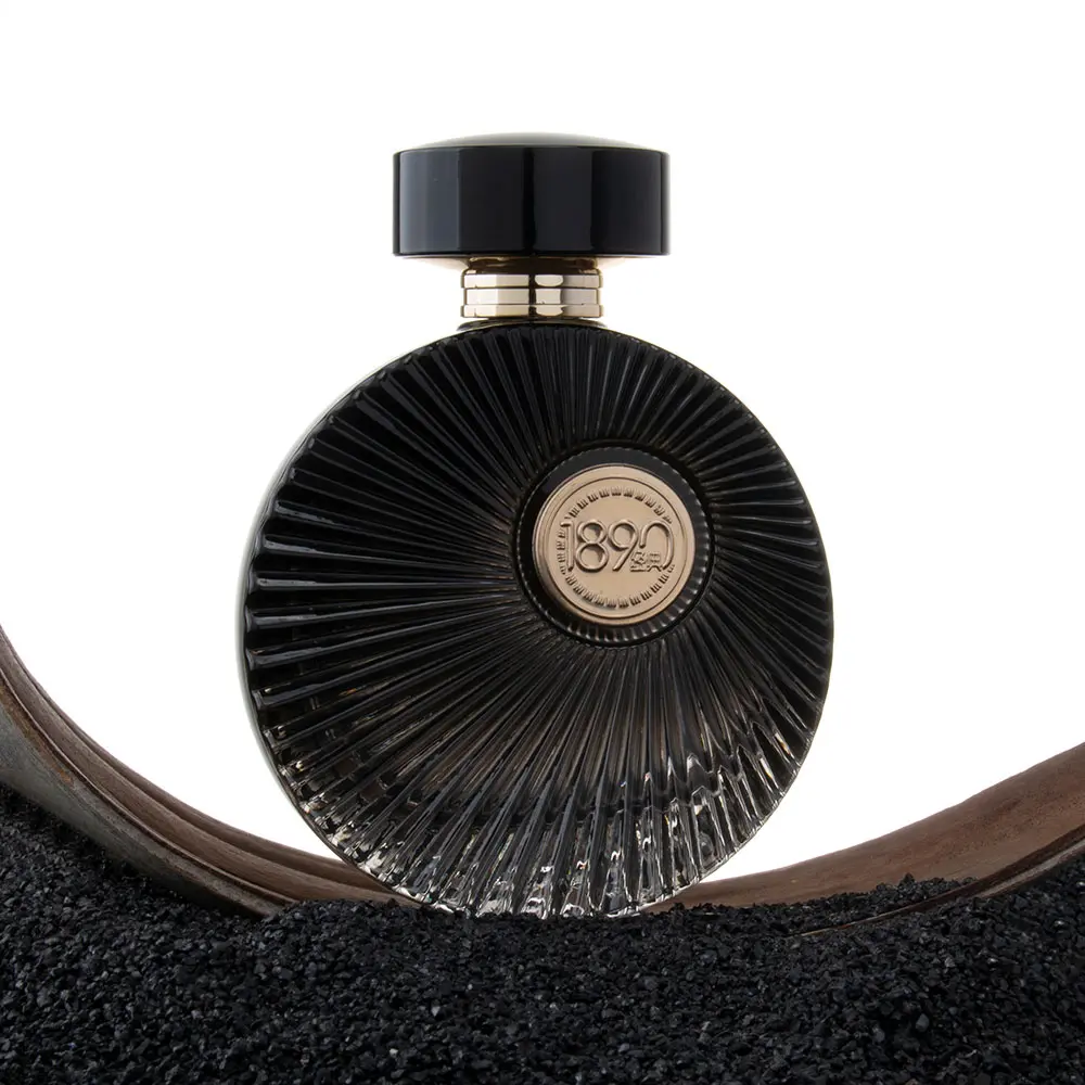 round cologne black bottle gold cap